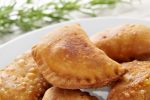 closeup of a plate with some spanish empanadillas, small meat or tuna pies, served as tapas