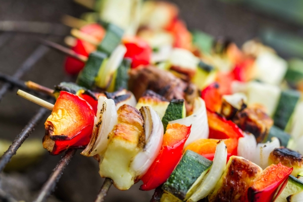 Shish kabobs with meat and vegetables on grill