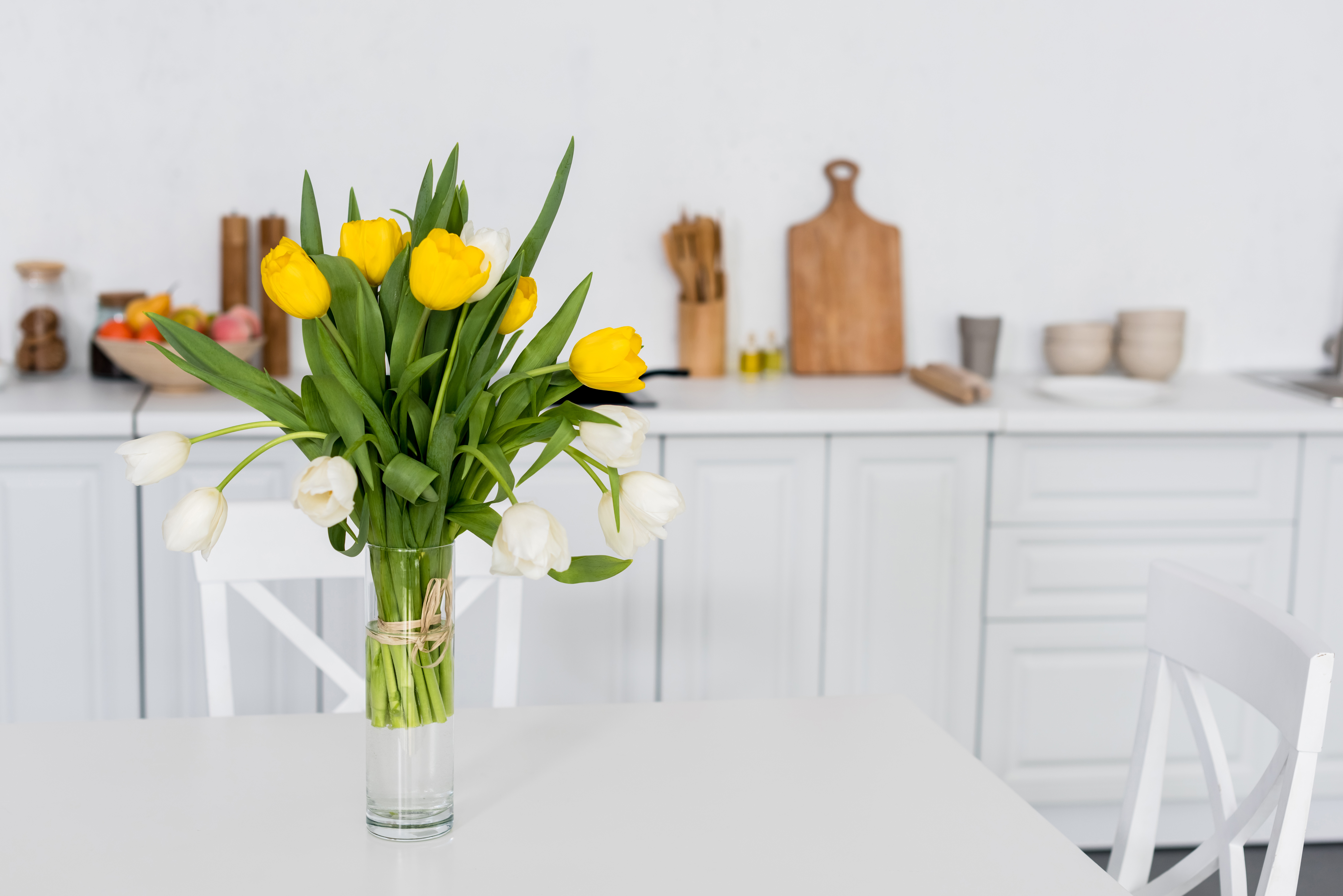 Yellow and White Tulips on Kitchen Table