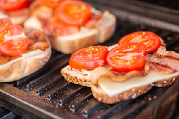 Toast with tomatoes on a plancha grill