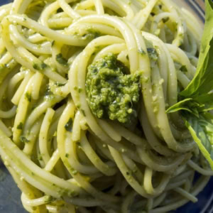 zucchini noodles with garlic scape pesto on a plate