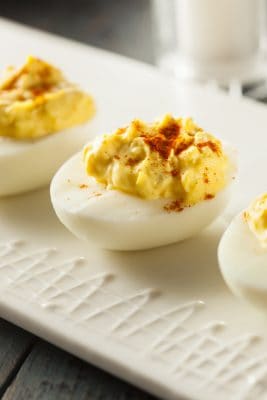 deviled eggs on a white tray