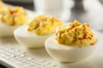 deviled eggs on a white tray