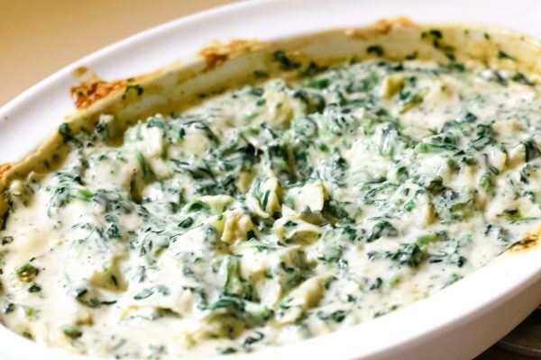 3 ingredient spinach and artichoke dip in a white pan