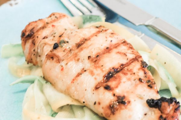 Marinated Chicken Breast on a bed of zucchini quick weeknight meal