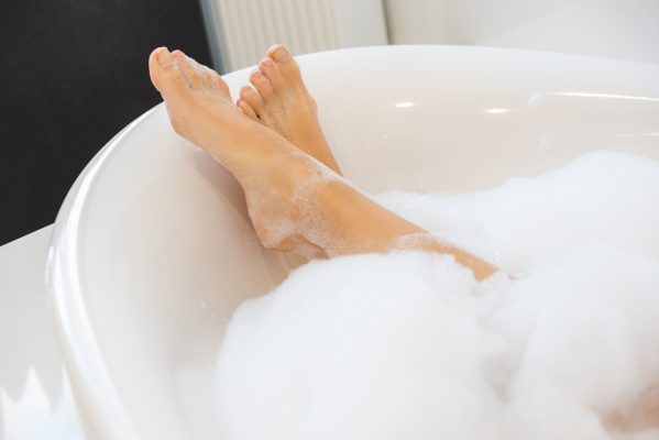 woman relaxing in bathtub