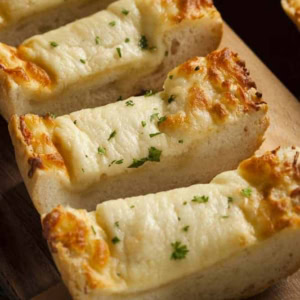 Cheesy Garlic Bread Slices on a cutting board