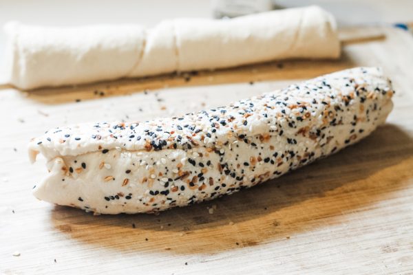 cresent dough roll covered in everything bagel seasoning