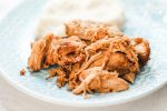 slow cooker balsamic pork and mashed potatoes on a blue plate