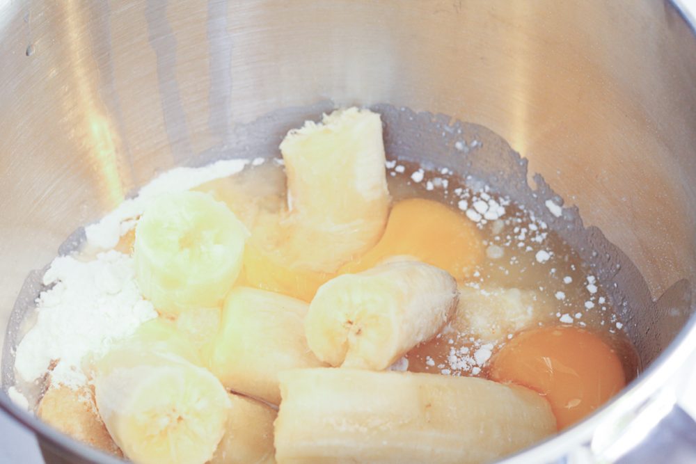 cake mix, bananas, and eggs in a mixing bowl