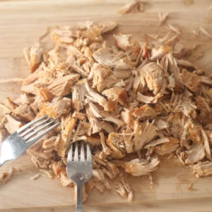 Shredded Mexican Carnitas on a cutting board
