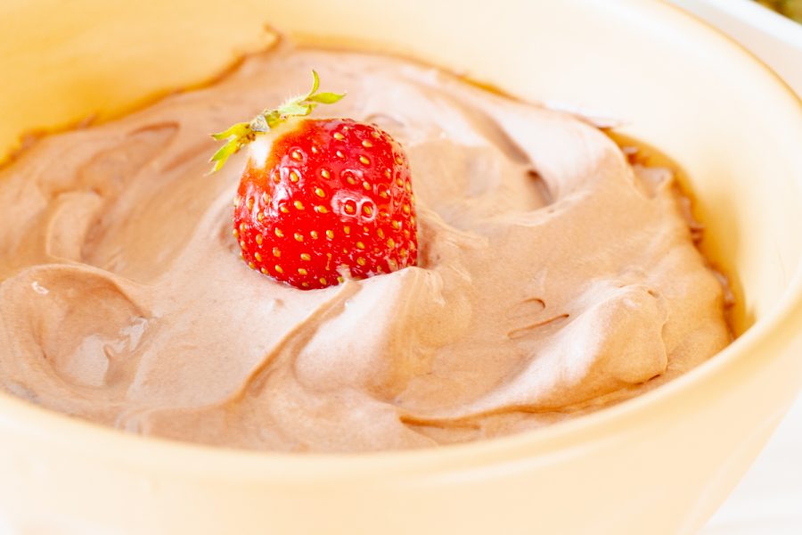 close up of a bowl of chocolate fruit dip