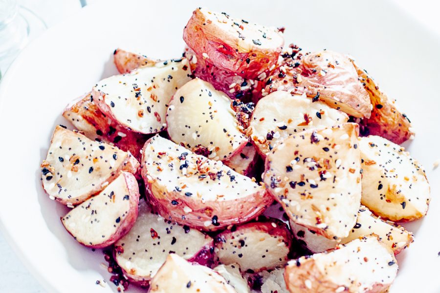 close up of potatoes sprinkled with everything bagel seasoning
