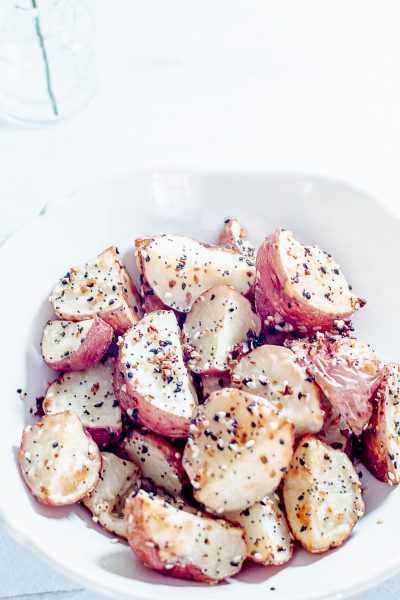 white bowl containing everything but the bagel roasted potatoes