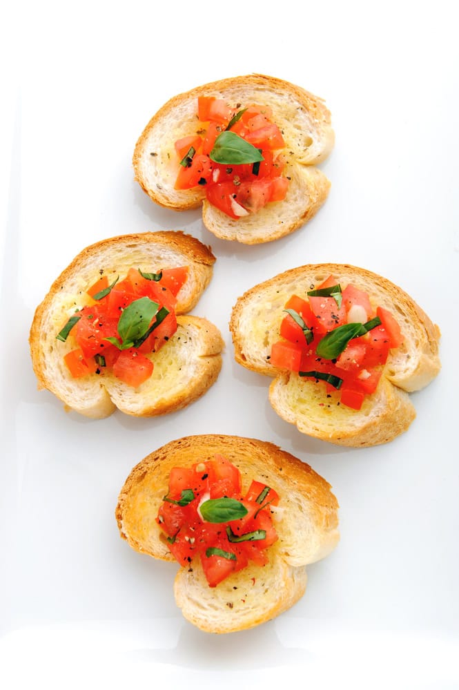 Italian brushetta; sliced baguette topped with a mixture of chopped tomato, garlic and basil