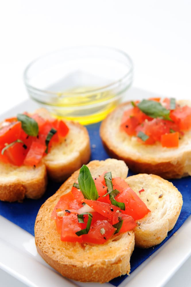 Italian brushetta; sliced baguette topped with a mixture of chopped tomato, garlic and basil