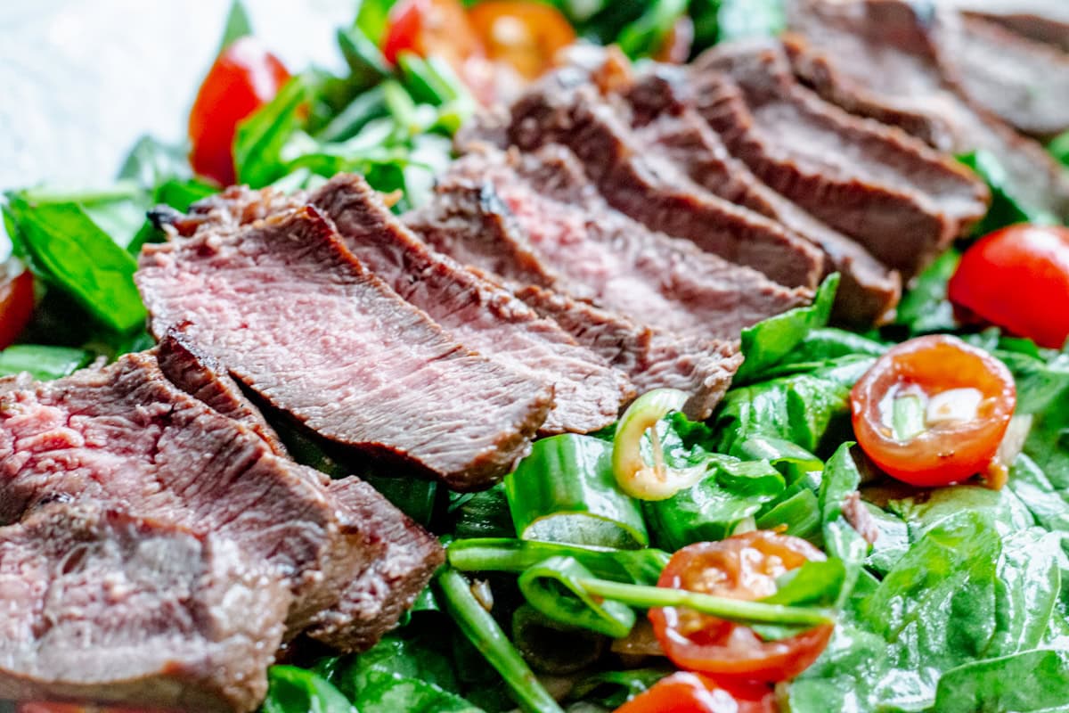 close up of rosemary grilled steak salad