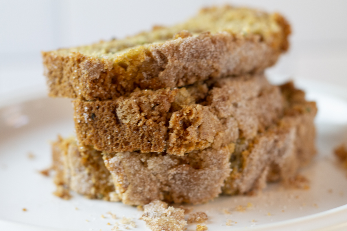 slices of snickerdoodle zucchini bread on a white plate