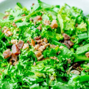 close up on endive salad with hot bacon dressing