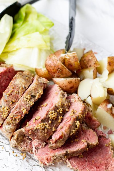platter of corned beef, cabbage, and potatoes