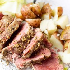 platter of corned beef, cabbage, and potatoes