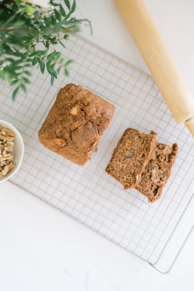 overhead view of sliced banana bread on a cooling rack