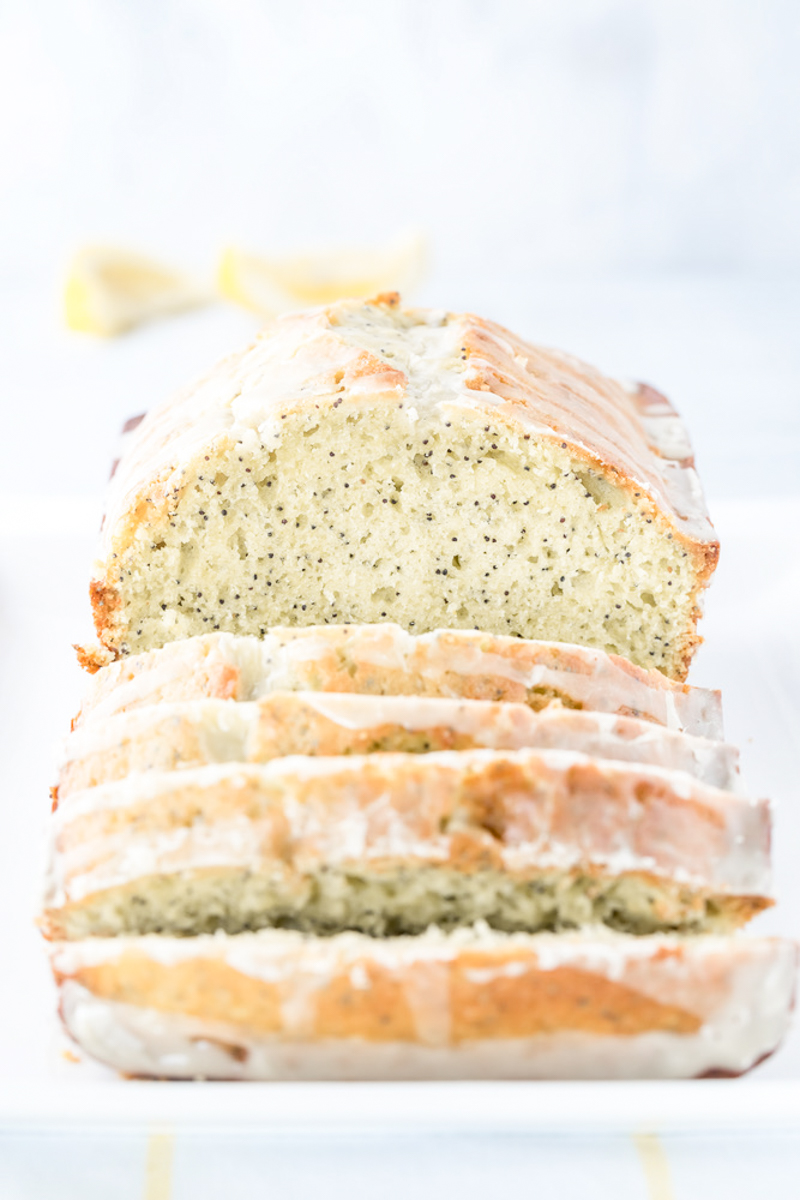 half sliced loaf of lemon poppy seed bread