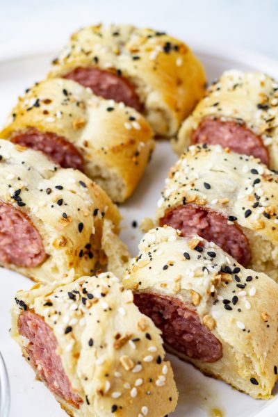 Kielbasa wrapped in crescent dough sprinkled with everything bagel seasoning