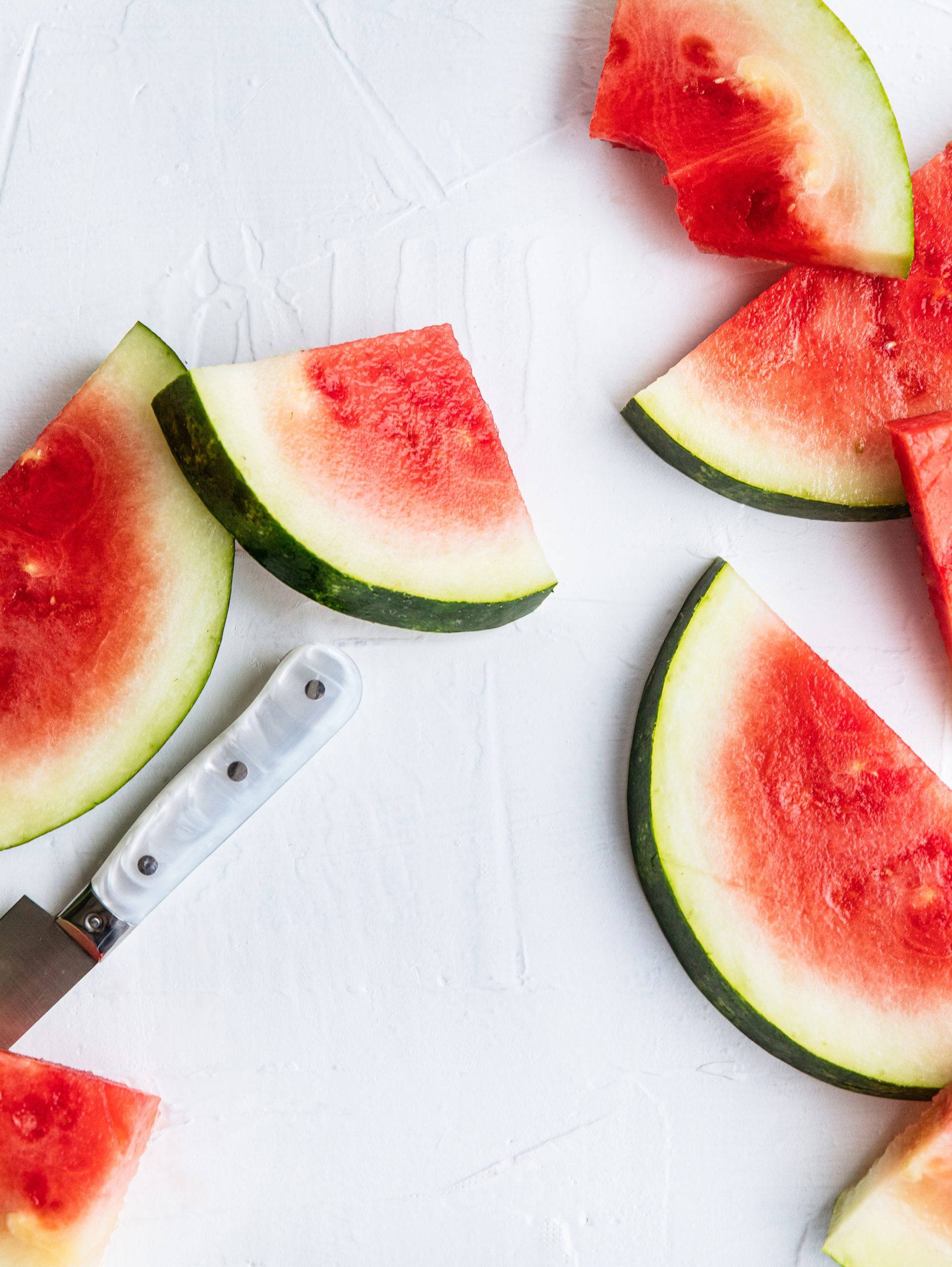 slices of watermelon on a white background