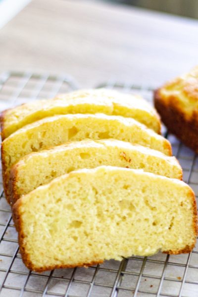 sliced easy lemon zucchini bread on a wire cooling rack