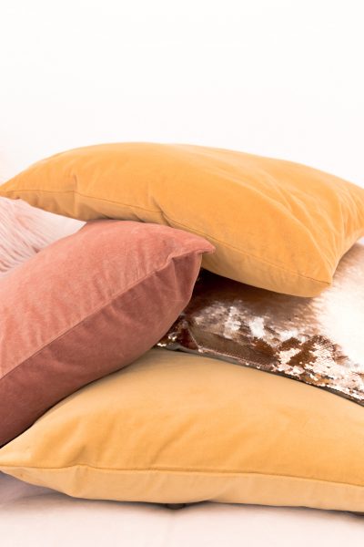 hygge pile of pillows in fall colors