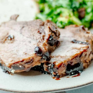 close up on pressure cooked instant pot pork roast on a plate