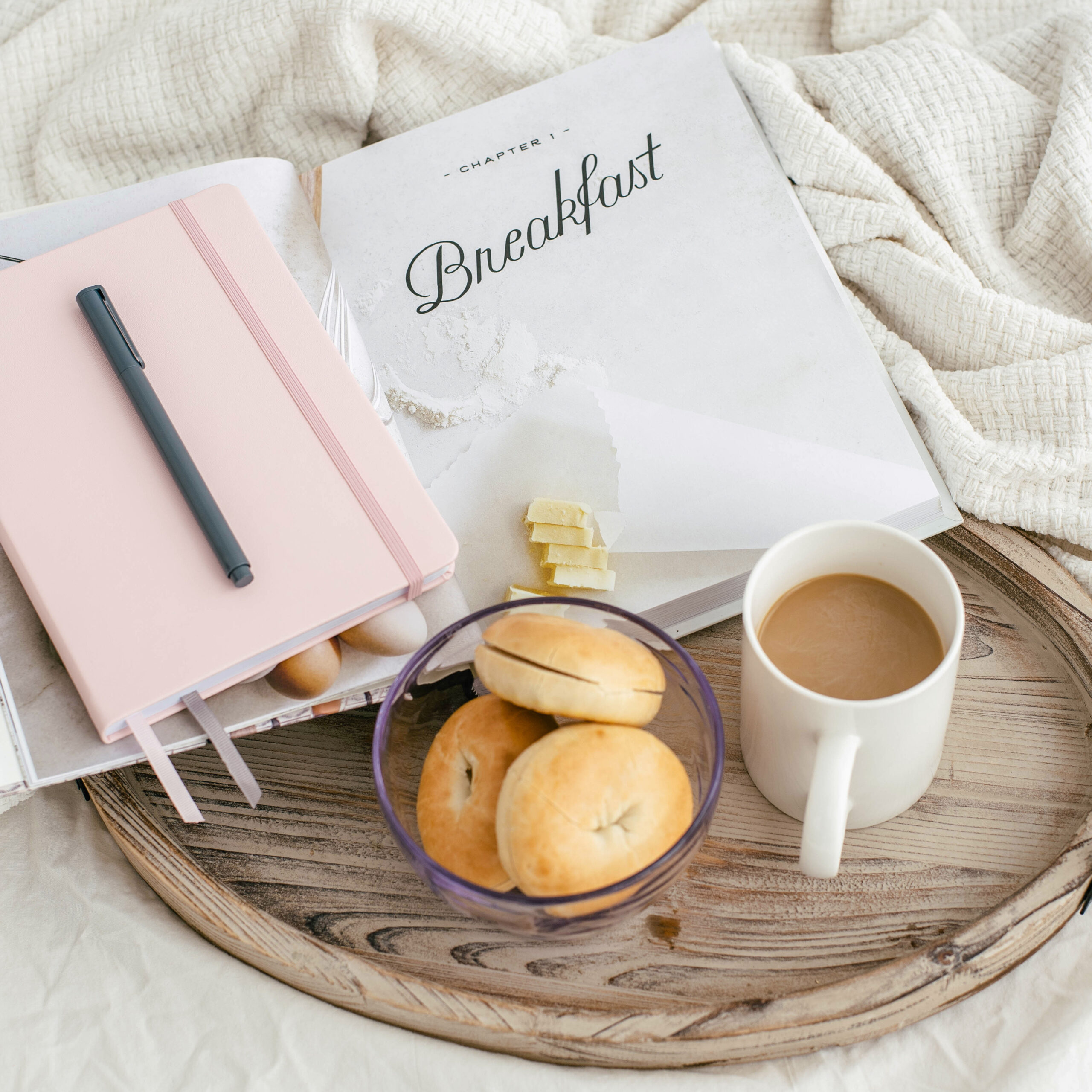 gray with bagels, coffee, and a book