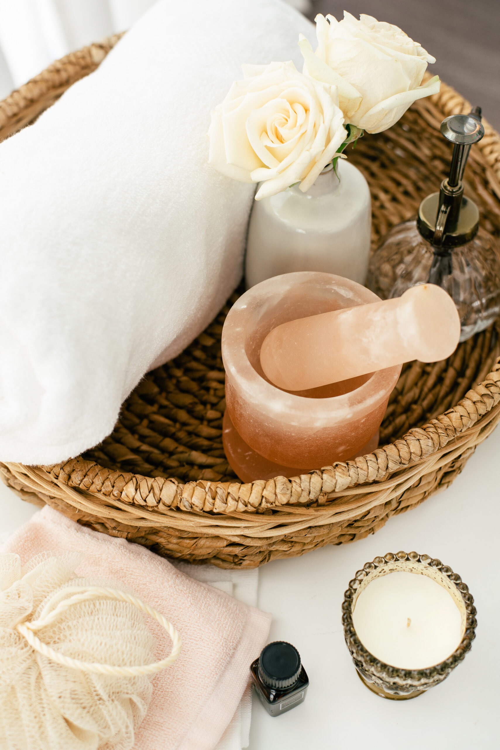 spa items in a basket on a bathroom counter