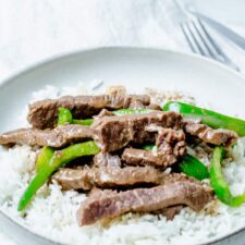bowl of instant pot beef pepper steak and white rice