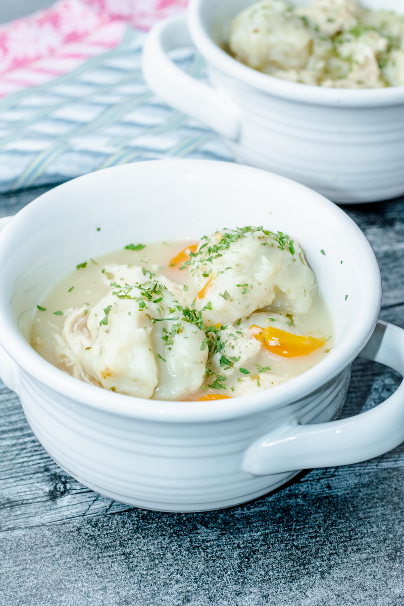 white crock bowlz filled with easy chicken and dumpling soup