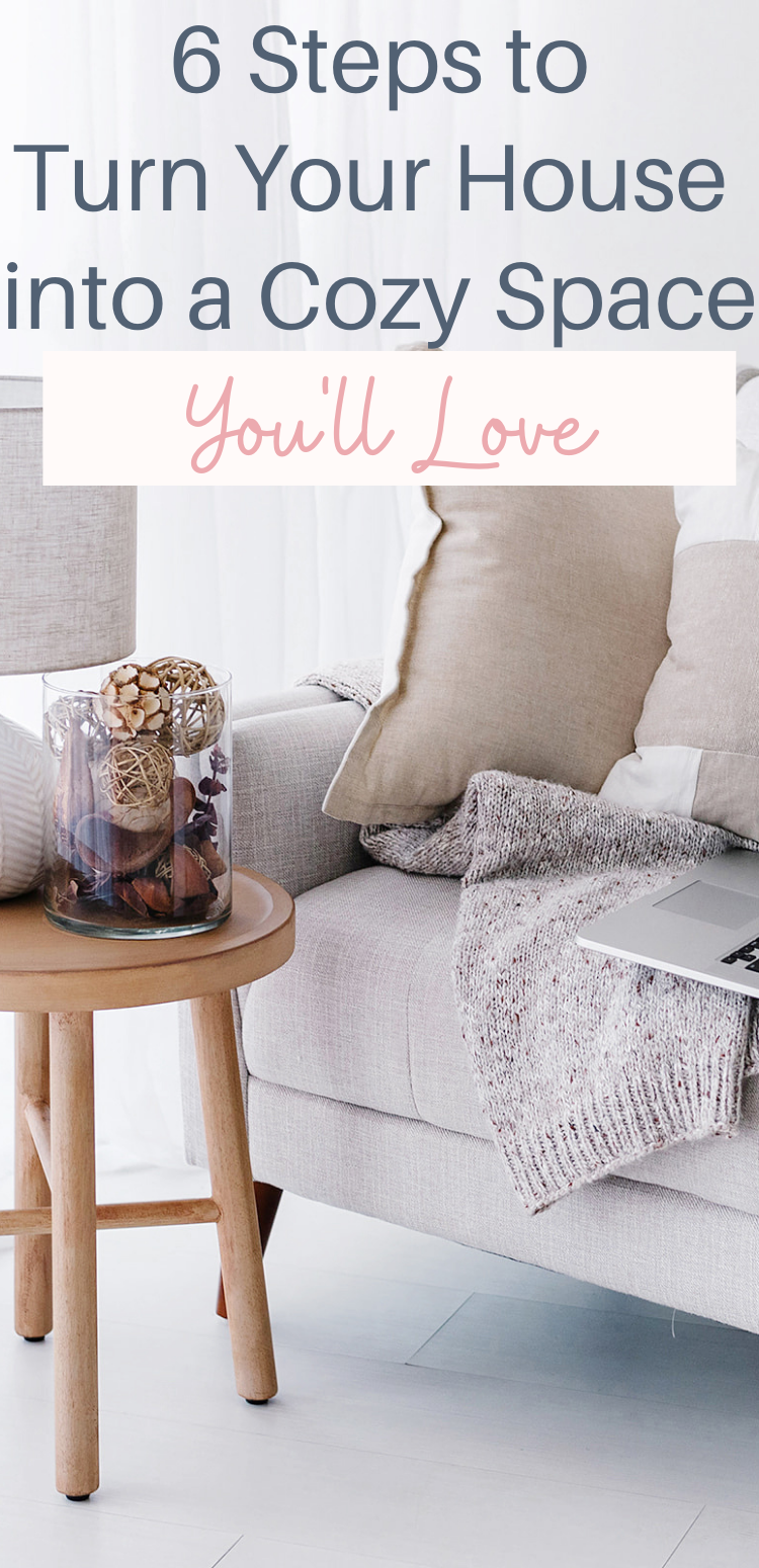 Pinterest Pin with a cozy living room scene and the words "6 steps to turn your house into a cozy space you'll love"