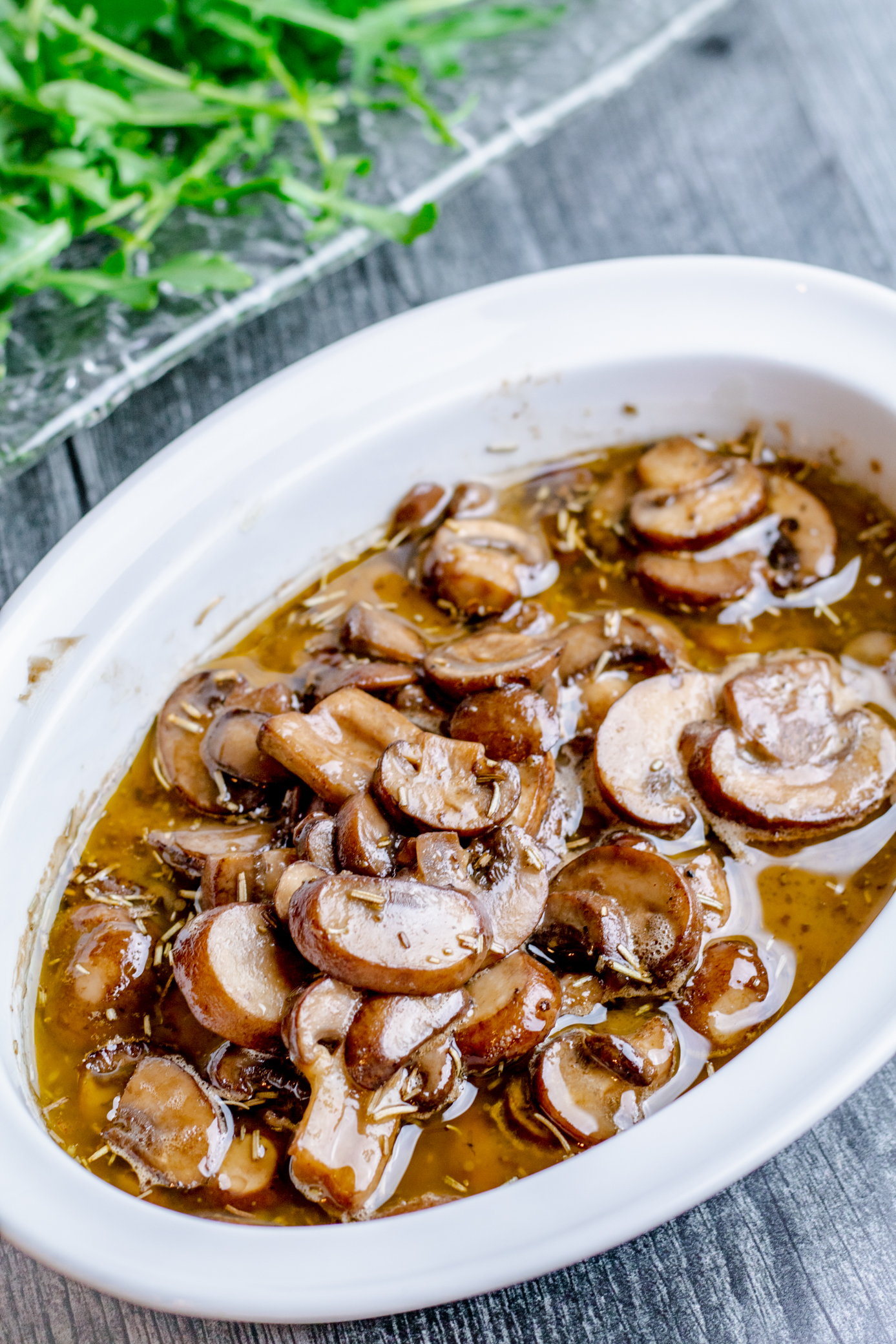 serving bowl filed with mushrooms smothered in detroit zip sauce