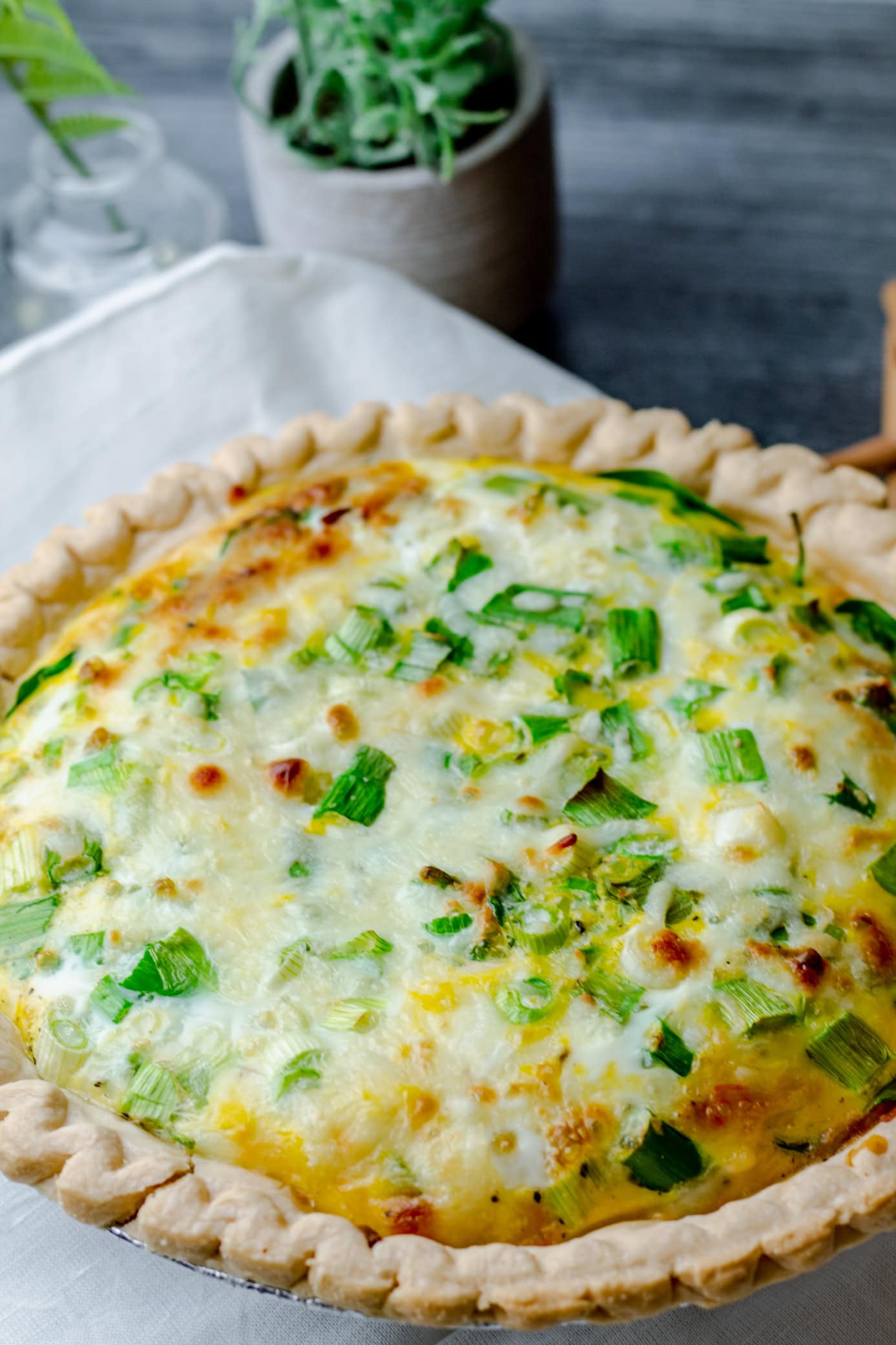 close up of spinach bacon quiche just out of the oven