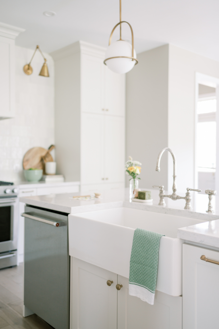 view of clean kitchen with focus on sink and dishwasher area