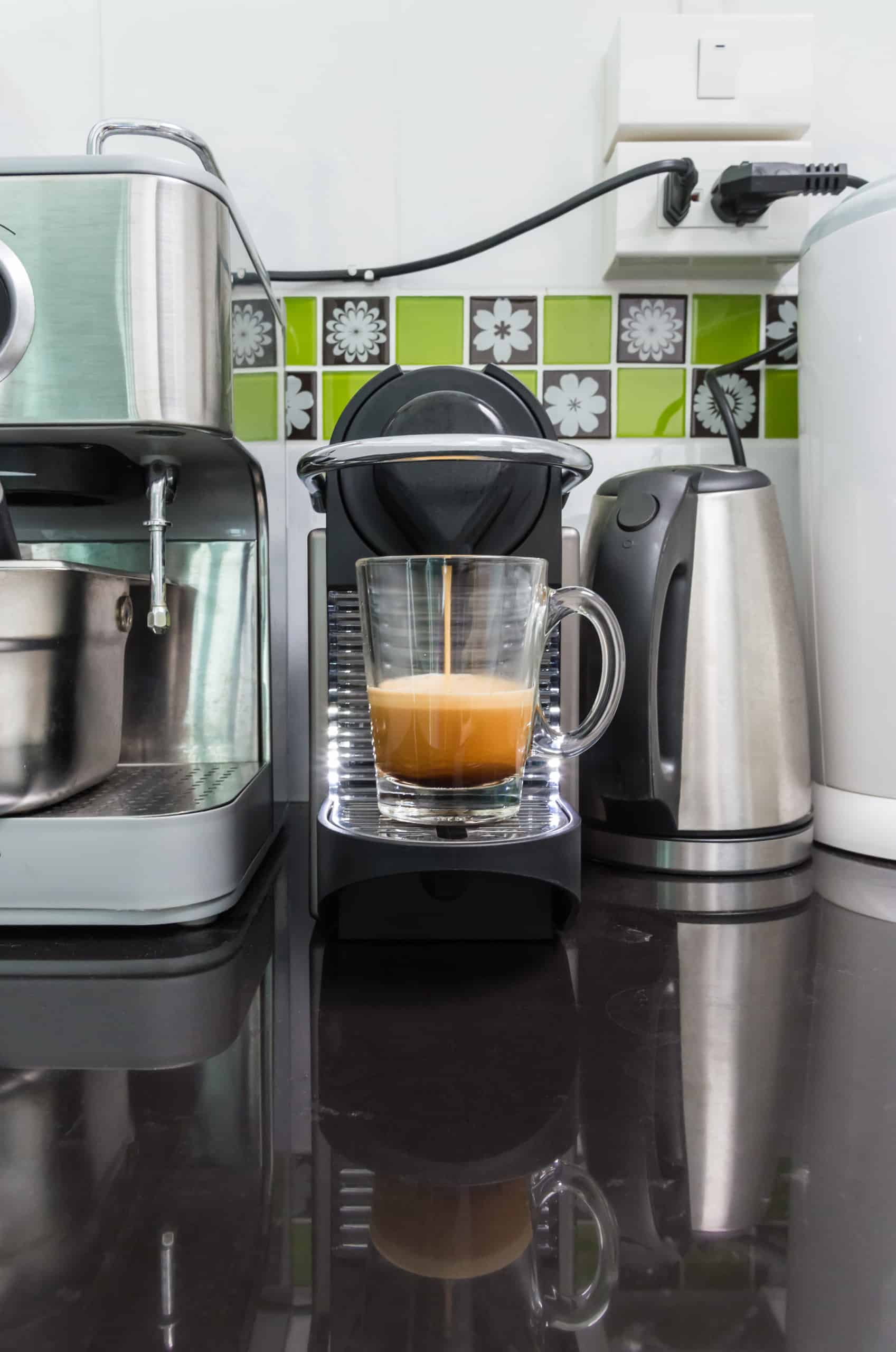 Modern capsule coffee machine with the fresh espresso shot.