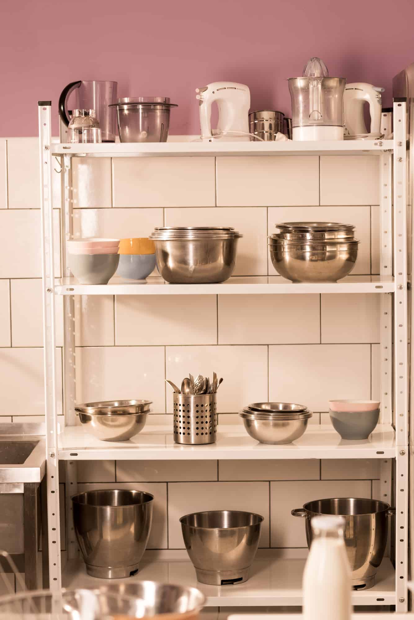 close up of various kitchen items on metal shelving