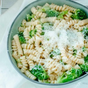overhead view of a bowl of Italian broccoli pasta on a wooden table