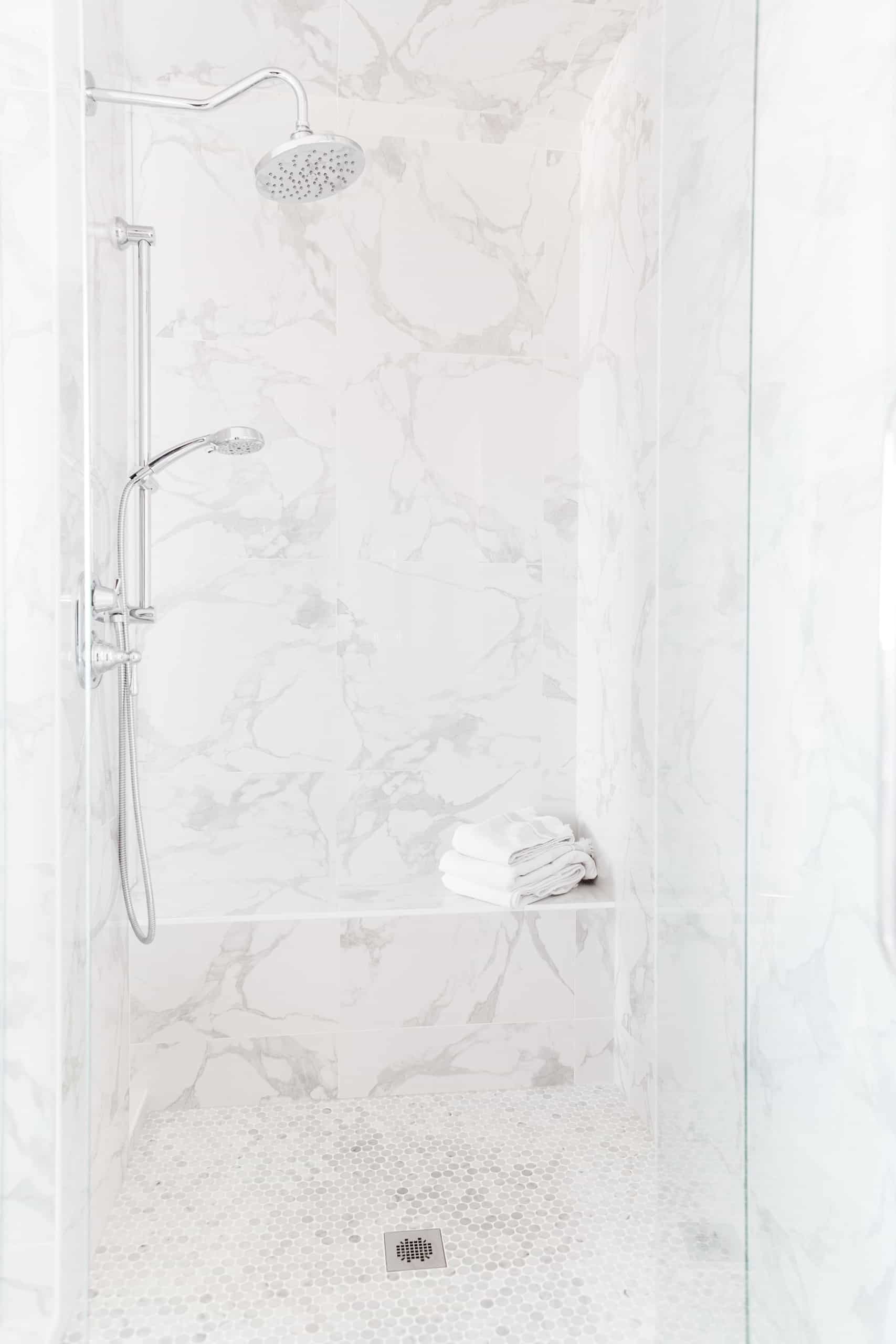 clean, clutter free shower with a clear door