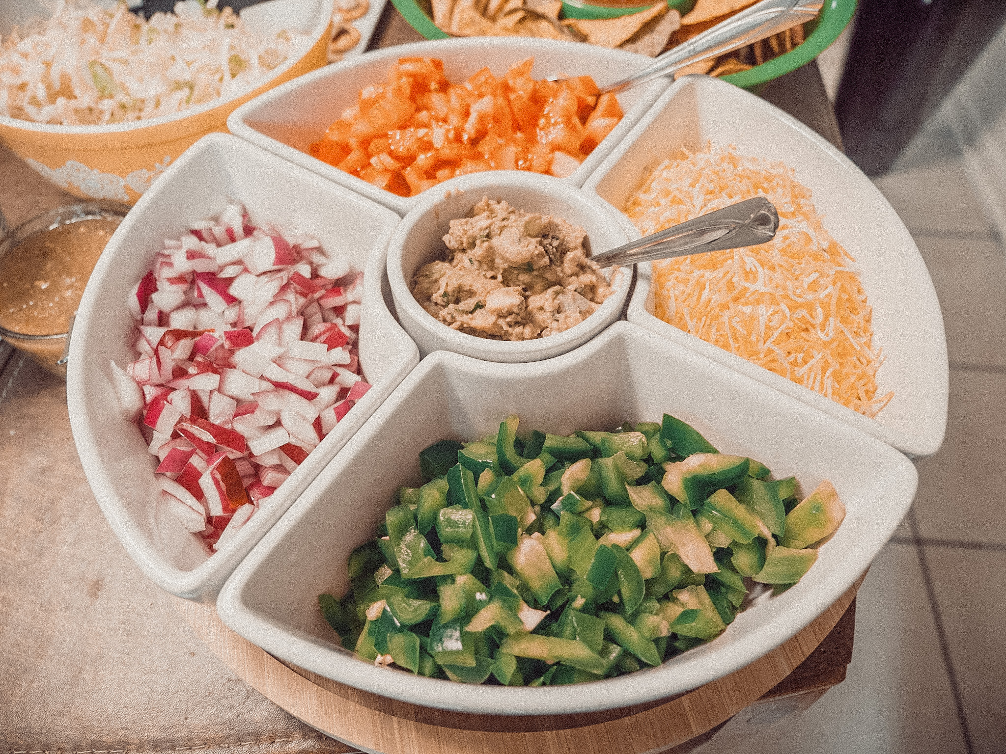 Overhead view of a tray with nacho and taco toppings