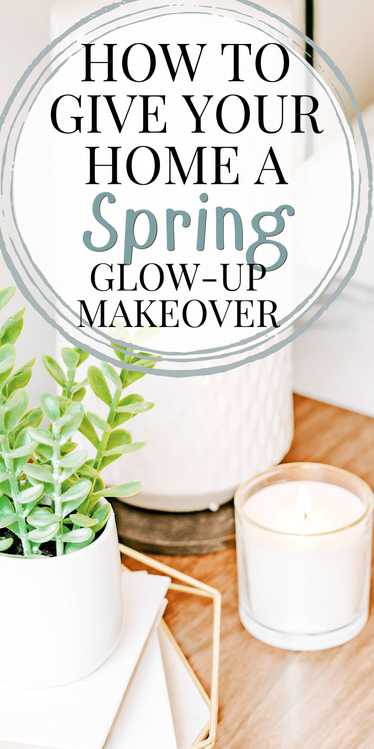 A Pinterest graphic with text overlay reading 'How to Give Your Home a Spring Glow-Up Makeover.' The image features a cozy vignette of a white candle, a small potted plant, and a white textured vase, creating a fresh and inviting look for spring.