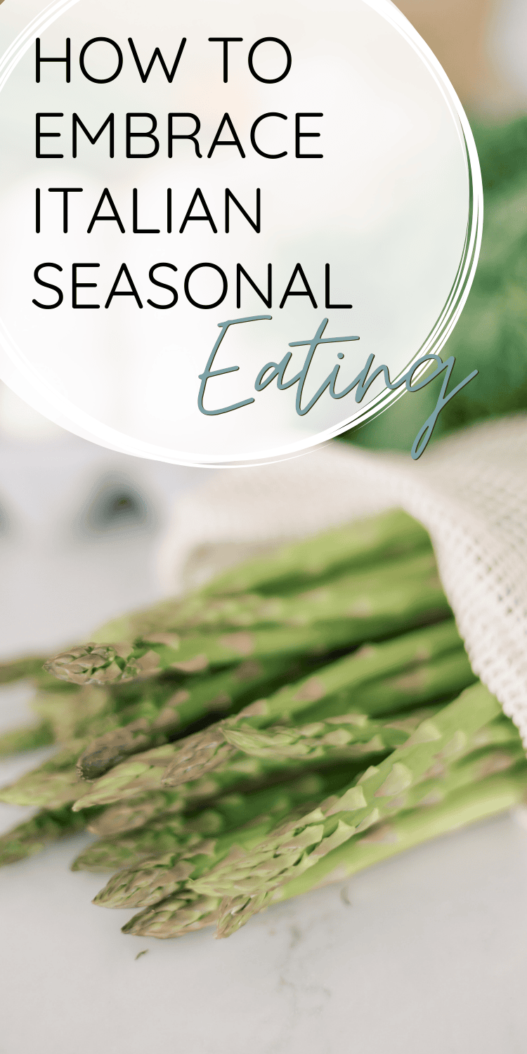 Fresh asparagus wrapped in a reusable mesh bag on a clean marble surface, highlighting sustainable and seasonal produce. The text overlay reads "How to Embrace Italian Seasonal Eating."