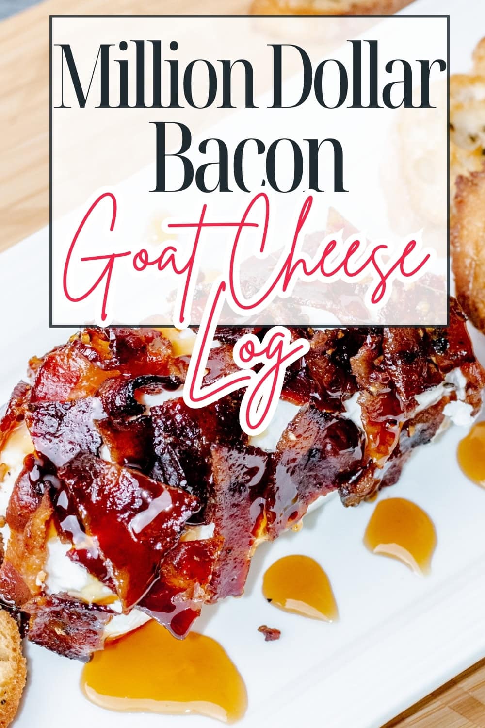 A bacon-wrapped goat cheese log drizzled with sauce sits on a white platter, with small pools of sauce and toasted bread slices nearby. Text overlay reads: Million Dollar Bacon Goat Cheese Log.