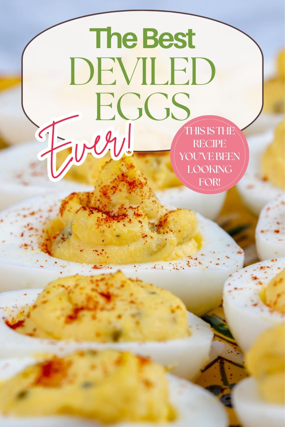 Close-up of deviled eggs topped with paprika, with text overlay: “The Best Deviled Eggs Ever! This is the recipe you’ve been looking for!” on a blurred background.