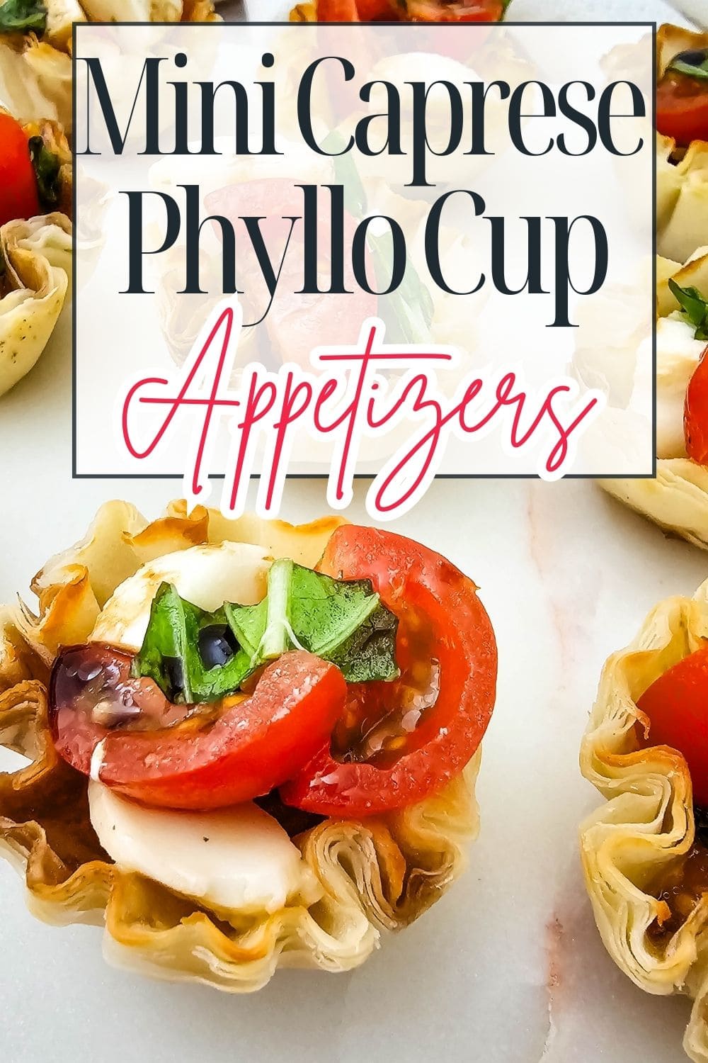 Mini phyllo cups filled with mozzarella, tomato slices, fresh basil, and a drizzle of balsamic, arranged on a white surface. Overlaid text reads: Mini Caprese Phyllo Cup Appetizers.